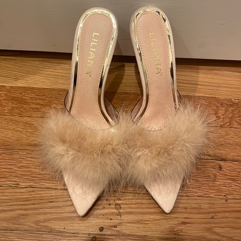 Cream Liliana heels with faux feathers. Never been worn.
